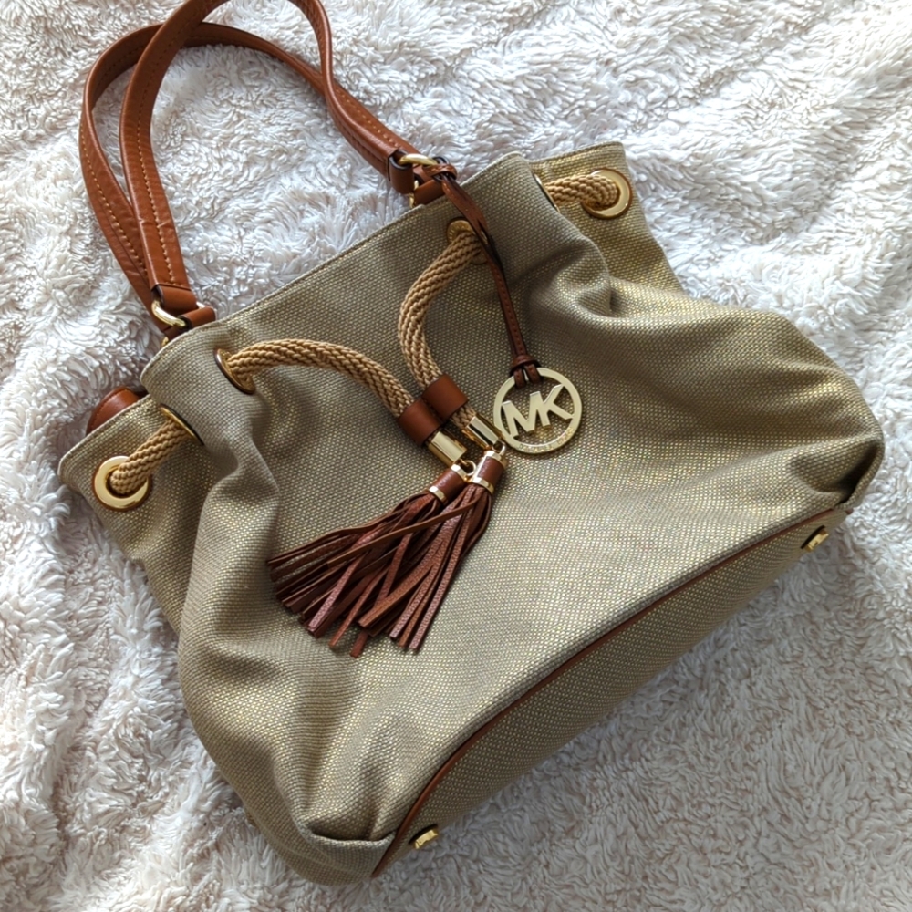 MICHAEL Michael Kors Gold Shimmer Canvas and Leather Tassel Drawstring S…